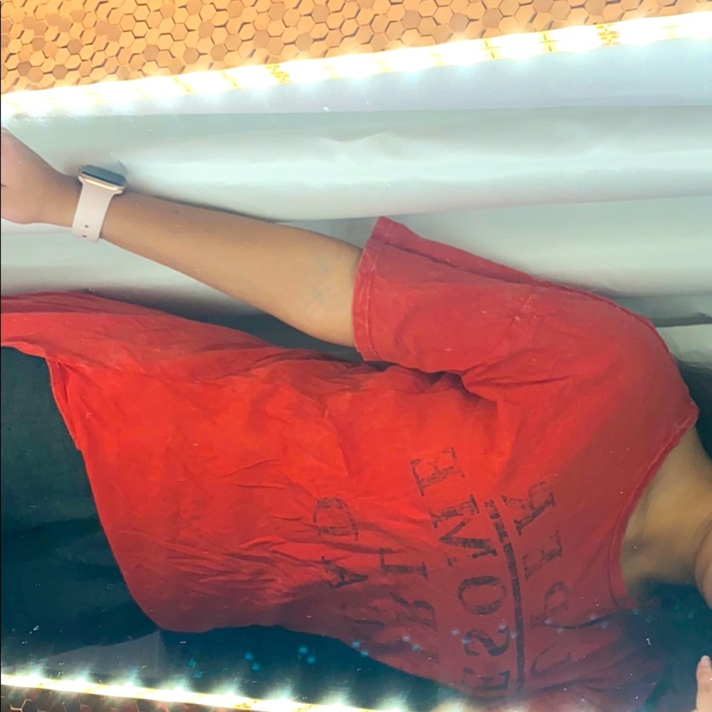 Red shirt with a long tail in back